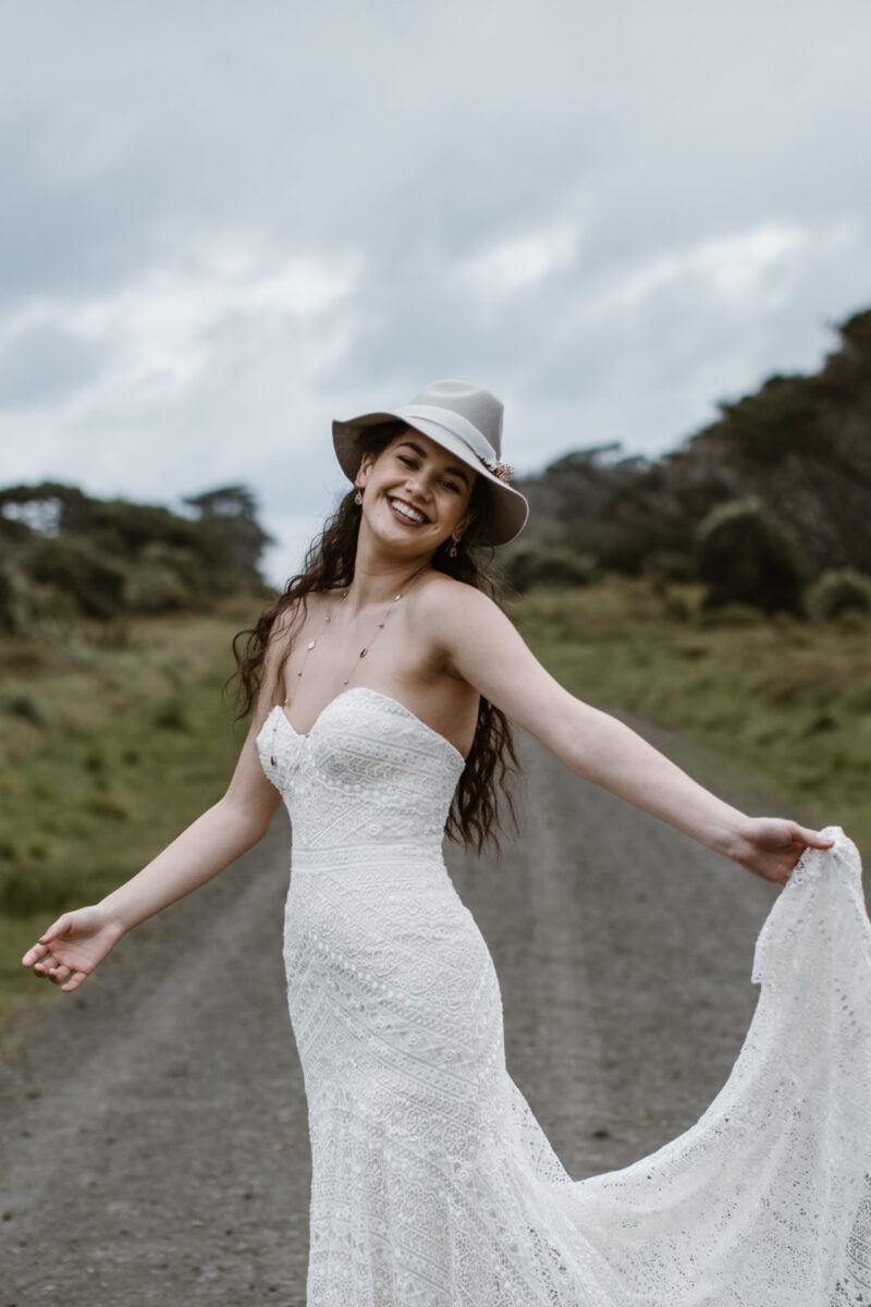 This strapless fit & flare gown is bohemian perfection. Soft geometric lace is placed thoughtfully throughout the silhouette to enhance your curves