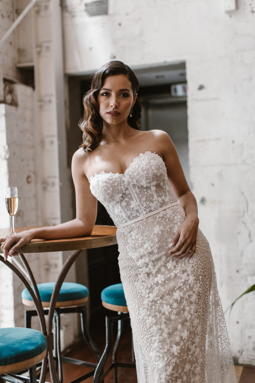 This stunning strapless champagne wedding gown is covered in hundreds of soft 3D beaded flowers, placed perfectly to create a unique pattern and silhouette.