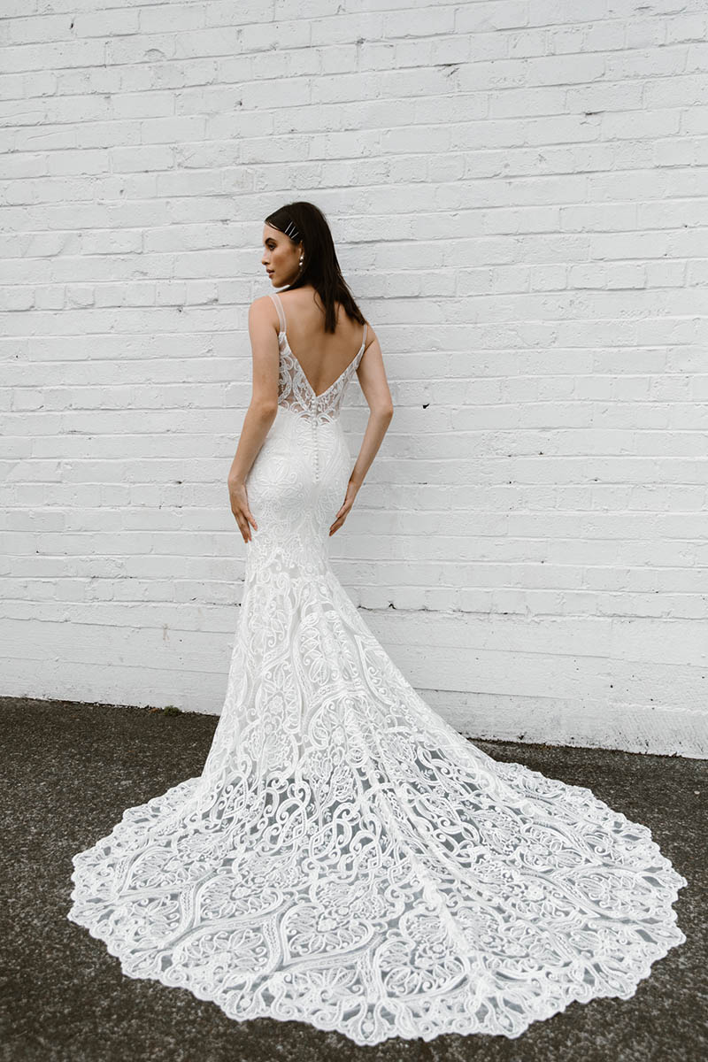 This wedding dress combines exquisite bridal details with bohemian beauty, a fishtail silhouette and gorgeous train that is perfect for your summer wedding