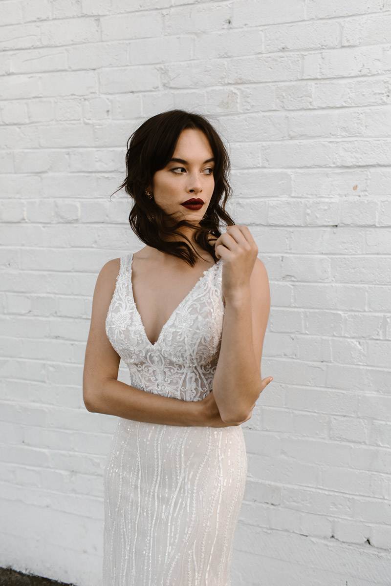 This classic fitted wedding dress features a deep neckline that is sexy & exciting partnered with a illusion V back that makes you look picture perfect.