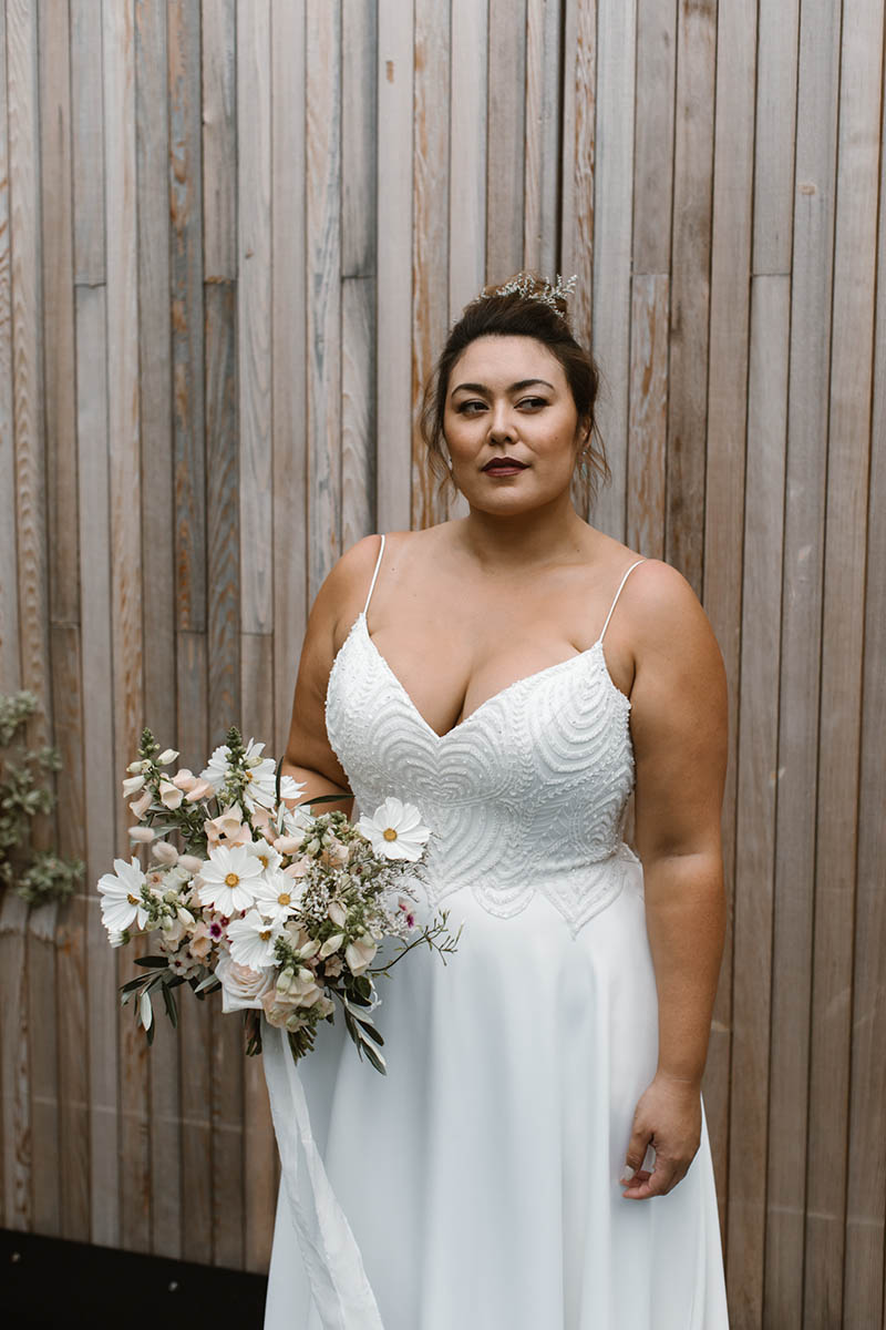 Our Suri gown is a classic A-line wedding gown with a beaded bodice, hidden pockets & soft satin skirt designed to be worn by women of any shape & size