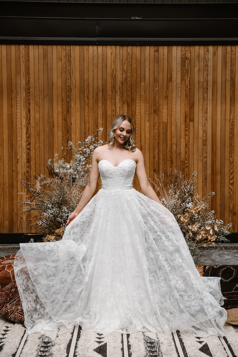 Aubrea is a modern yet classic A-line silhouette. On-trend brides are lusting over the structured & exposed-bone bodice and layers of soft lace. 