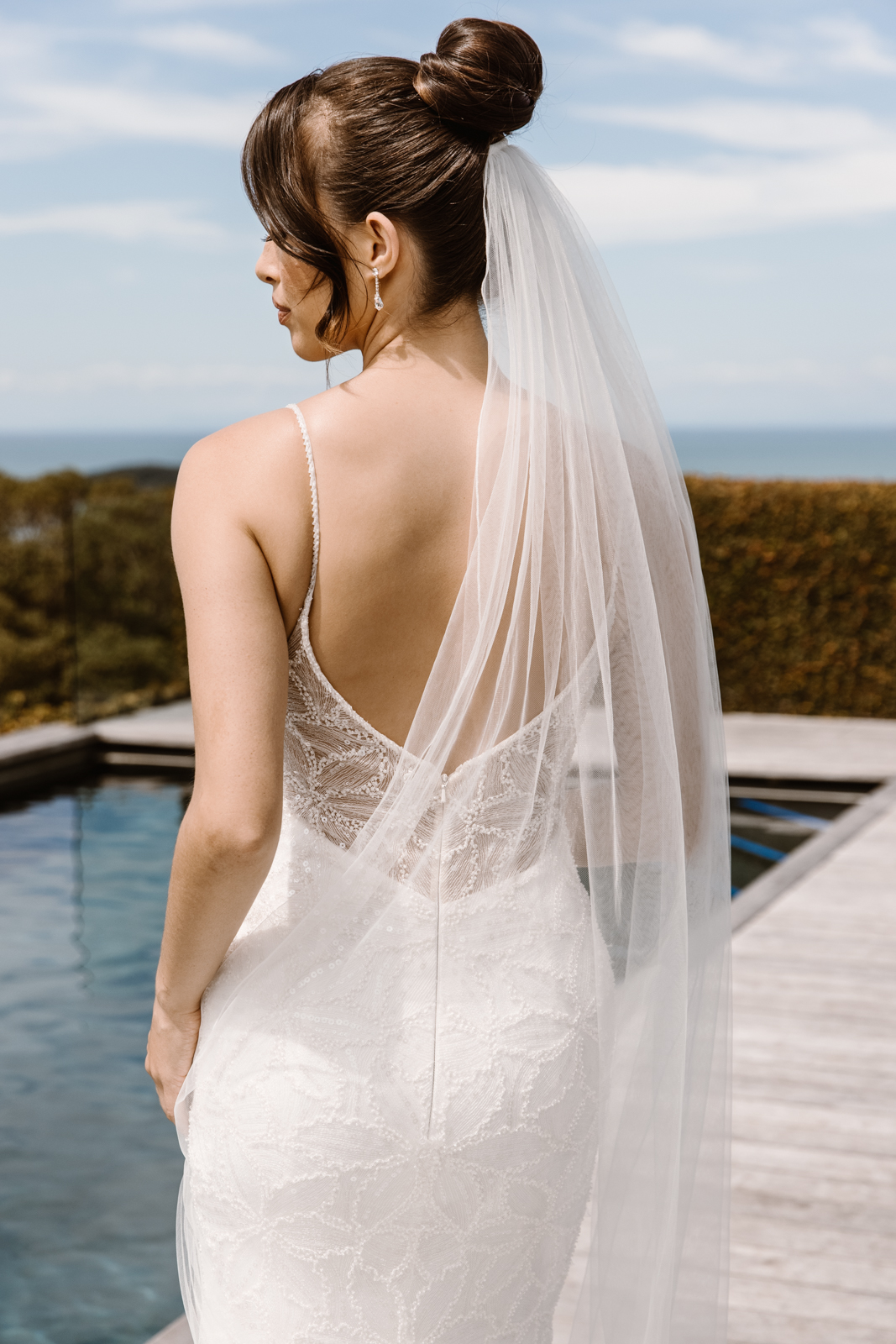 Regan is for the modern, fashion-forward bride. A deep neckline, A-line skirt & playful side-split adds the perfect juxtaposition of classic & edgy.