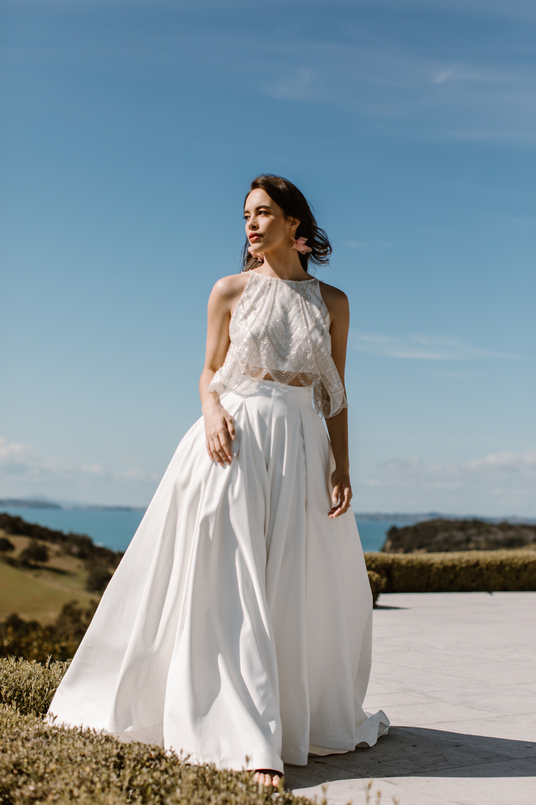 This wedding dress is the essence of love, from the soft illuison bodice to the fishtail shape and detachable half skirt which blooms behind